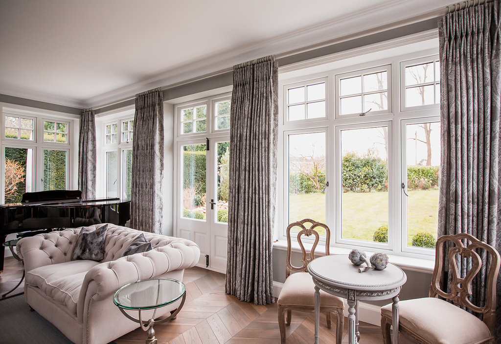 Full length interlined curtains in soft grey with metal grey pole