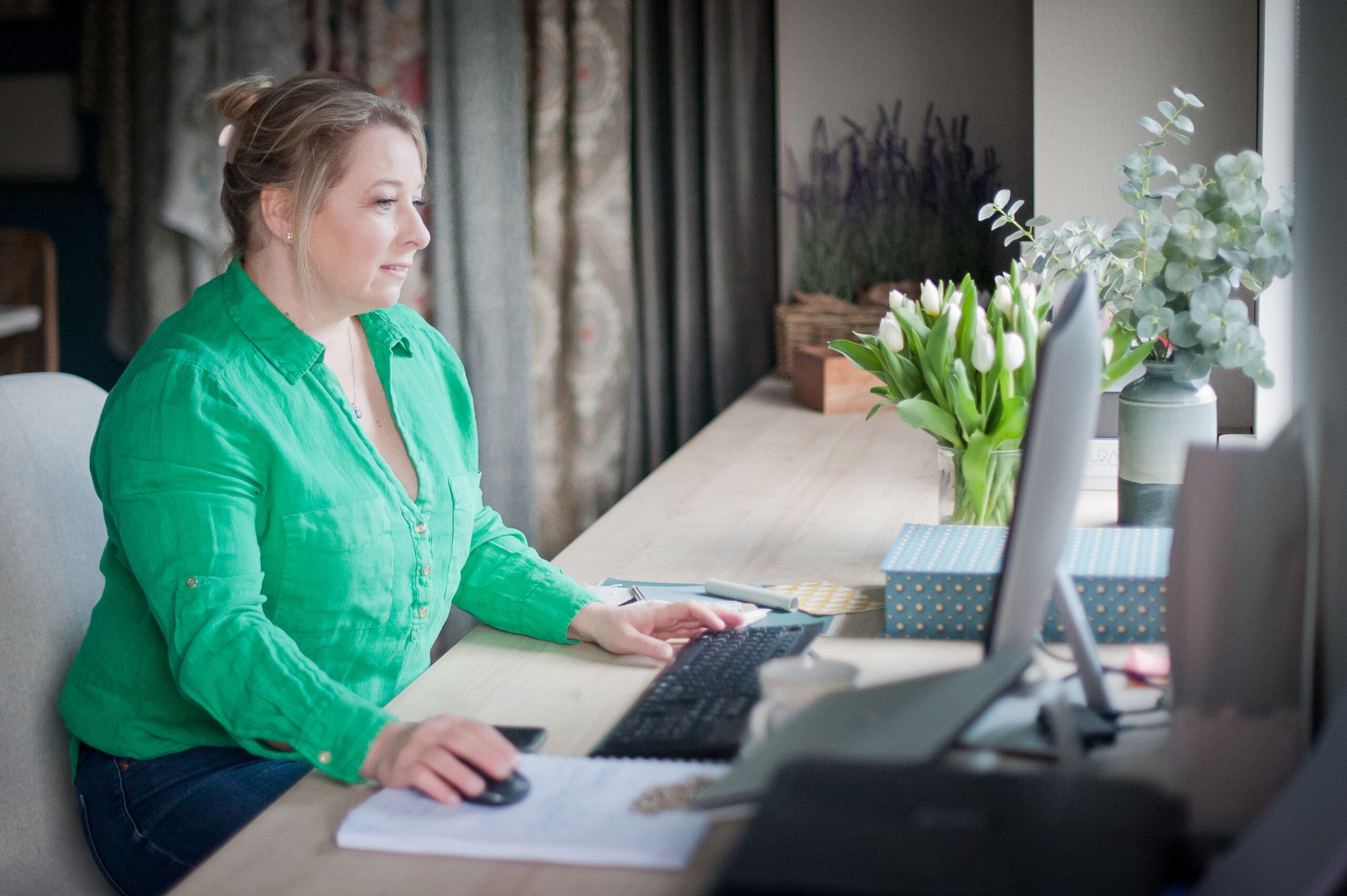 Susie Wigg working at her desk