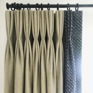 Triple pleat interlined curtains in Mark Alexander linen with contrast leading edge, fitted to a Bradley Collection steel pole